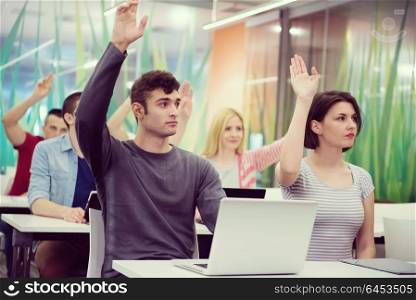 teacher teaching lessons, smart students group raise hands up in school classroom