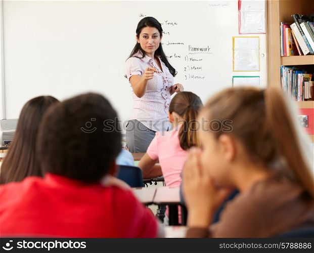 Teacher telling off children in class