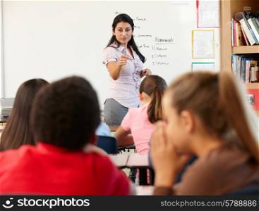Teacher telling off children in class