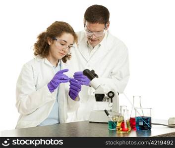 Teacher watches as a college or high school student prepares a slide for viewing under a microscope. White background