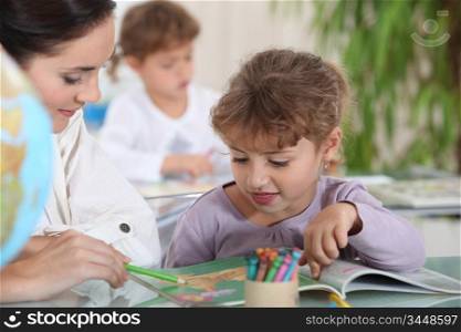 Teacher with a little girl