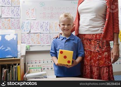 Teacher with Little Boy Holding Large Die