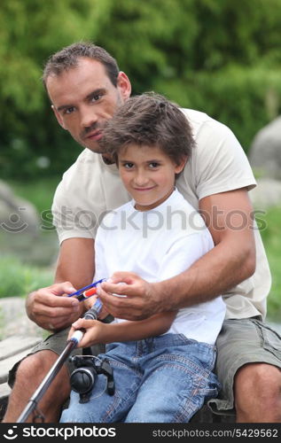 Teaching his son to fish