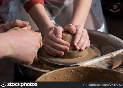 Teaching pottery to children. The teacher gives a master class in modeling. children&rsquo;s pottery studio