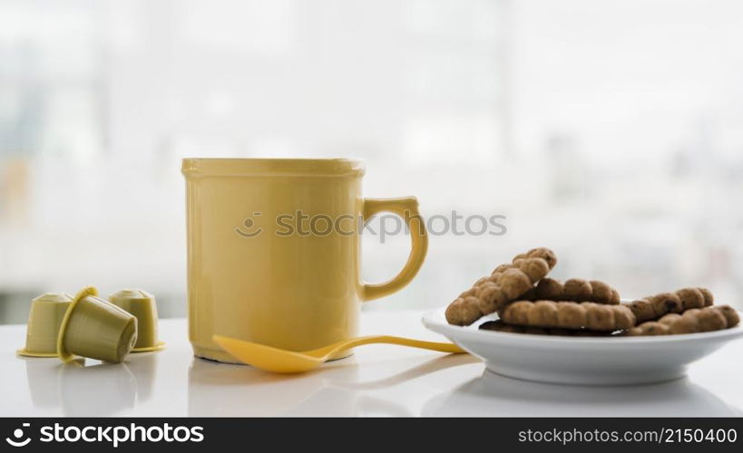 teacup with biscuits