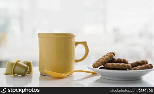 teacup with biscuits
