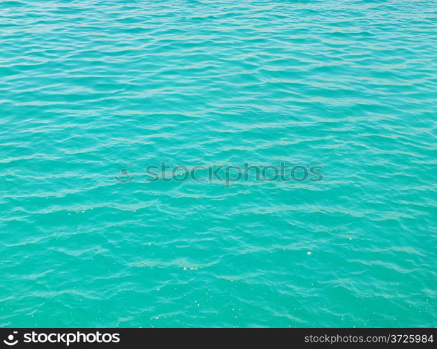 Teal water surface with ripples of Aegean sea