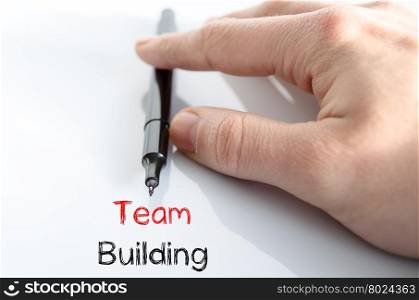 Team building note in business man hand