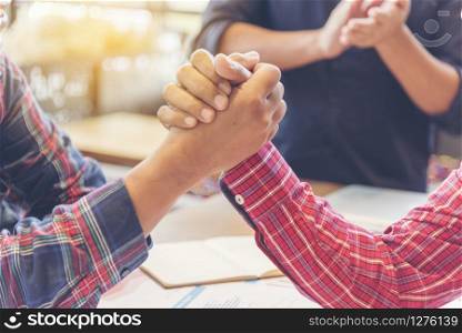Team Business Partners Giving Fist Bump after complete a deal. Successful Teamwork Partnership in an office. Businessman with hands together. industry business concept.