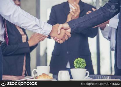 Team Business Partners shaking hands together to Greeting Start up new project. Shakehand Teamwork Partnership outside office modern city background. Businessman handshake together.  Business concept