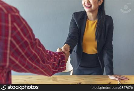 Team Business Partners shaking hands together to Greeting Start up small business in meeting room. Shakehand teamwork partners at modern office handshake together. Business mergers and acquisitions