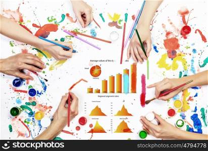 Team creative work. Top view of people hands drawing business growth concept