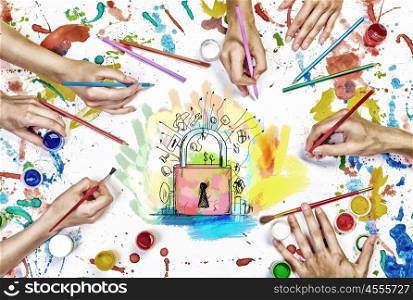 Team creative work. Top view of people hands drawing business solution concept with paints