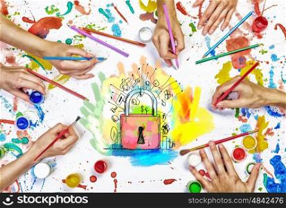 Team creative work. Top view of people hands drawing business solution concept with paints