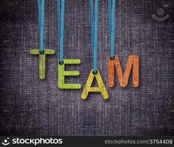 Team Letters hanging strings with blue sackcloth background.. Team