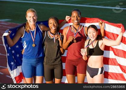 Team of American female athletes celebrating victory