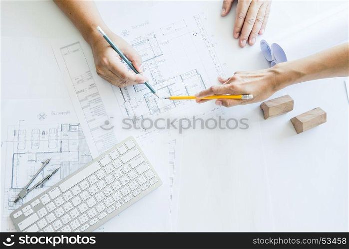 Team of architects people in group on construciton site check documents and business workflow.