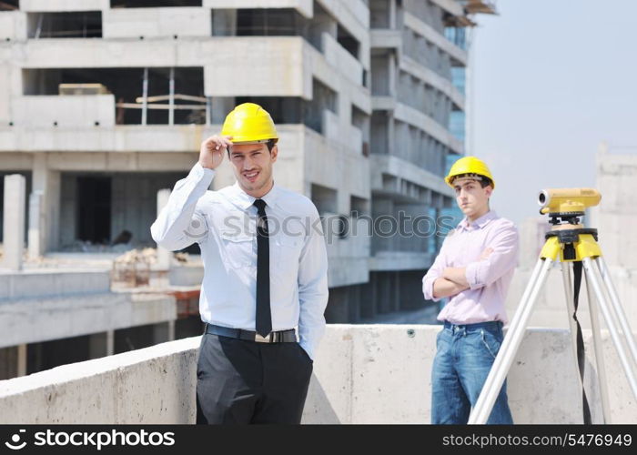 Team of architects people in group on construciton site check documents and business workflow