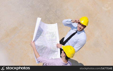 Team of architects people in group on construciton site check documents and business workflow