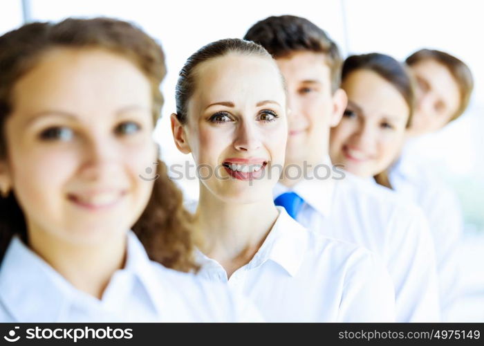 Team of business people. Image of young business people standing in line. Interaction concept