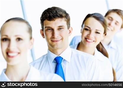 Team of business people. Image of young business people standing in line. Interaction concept
