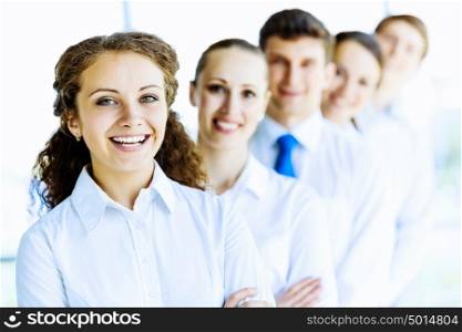 Team of business people. Image of young business people standing in line. Interaction concept