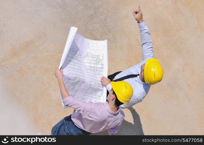 Team of business people in group, architect and engeneer on construciton site check documents and business workflow on new building