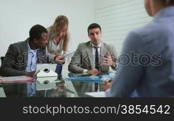 Team of business people working and talking during meeting in office room. 2of20