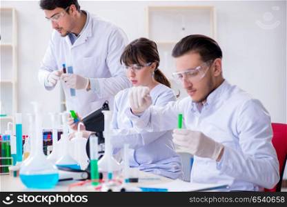 Team of chemists working in the lab