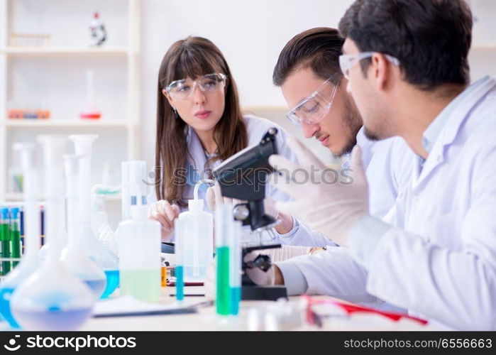 Team of chemists working in the lab