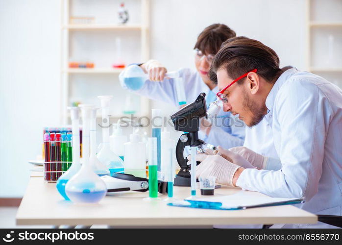 Team of chemists working in the lab