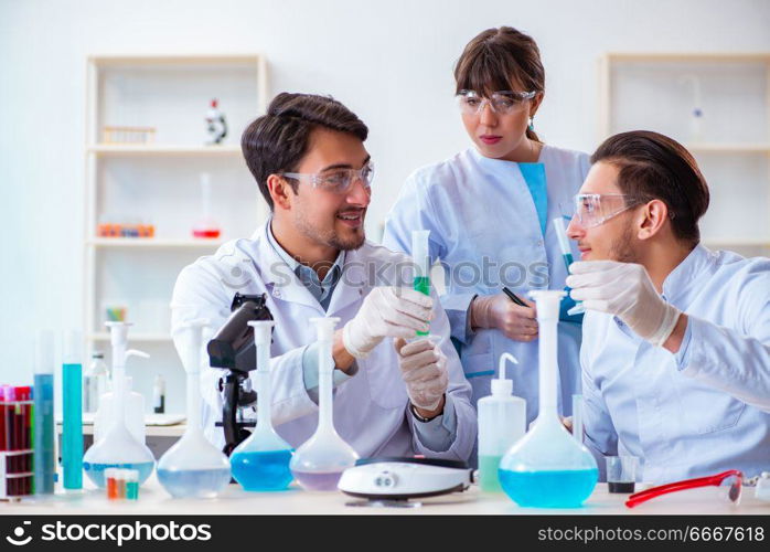 Team of chemists working in the lab