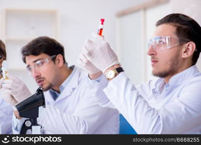 Team of chemists working in the lab