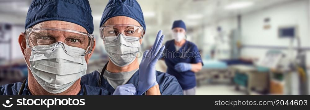Team of Female and Male Doctors or Nurses Wearing Personal Protective Equiment In Hospital Emergency Room.