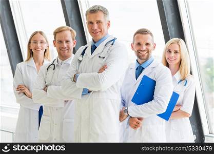 Team of medical doctors. Successful team of medical doctors are looking at camera and showing thumbs up