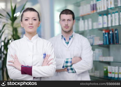 team of pharmacist chemist woman and man group standing in pharmacy drugstore