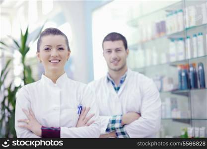 team of pharmacist chemist woman and man group standing in pharmacy drugstore