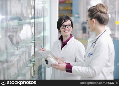 team of pharmacist chemist woman group standing in pharmacy drugstore