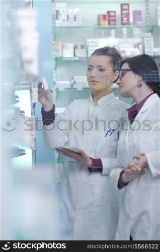team of pharmacist chemist woman group standing in pharmacy drugstore