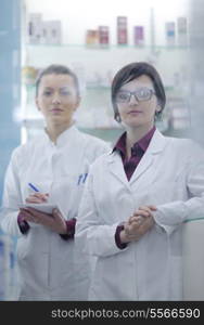 team of pharmacist chemist woman group standing in pharmacy drugstore