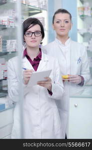 team of pharmacist chemist woman group standing in pharmacy drugstore