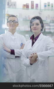 team of pharmacist chemist woman group standing in pharmacy drugstore