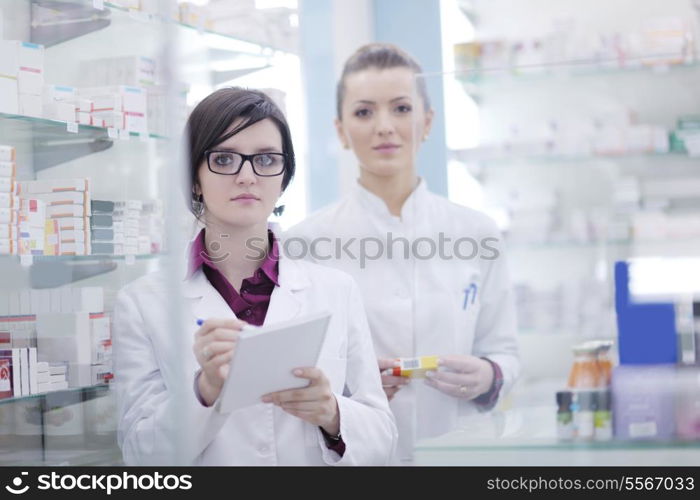 team of pharmacist chemist woman group standing in pharmacy drugstore