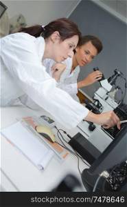 team of scientists in a laboratory working on chemical testing