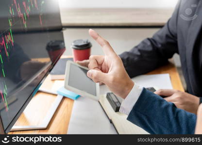 Team of stockbrokers Discussing with display screens Analyzing data, graphs and reports of stock market trading for investment