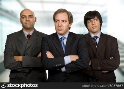 team of three business men standing pensive