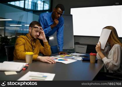 Team of tired managers, discussion in IT business office. Professional teamwork and planning, group brainstorming and corporate work. Team of tired managers, group brainstorming