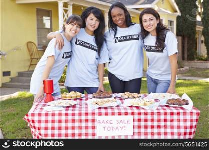 Team Of Women Running Charity Bake Sale