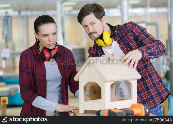 team of wood workers in a workshop