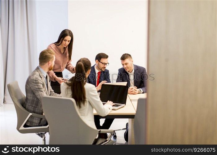 Team of young colleagues working together in an office